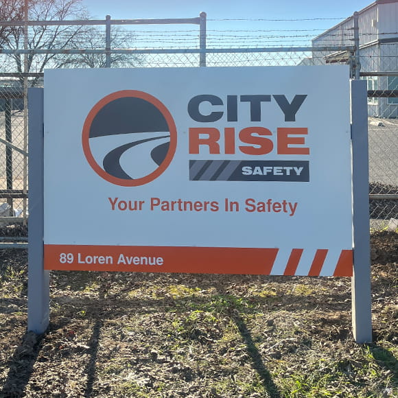 a post and panel sign shows a sign sitting between two posts. It is elevated off the ground.